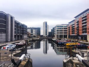 high rise buildings with body of water