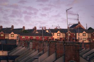 a row of houses with a sky in the background