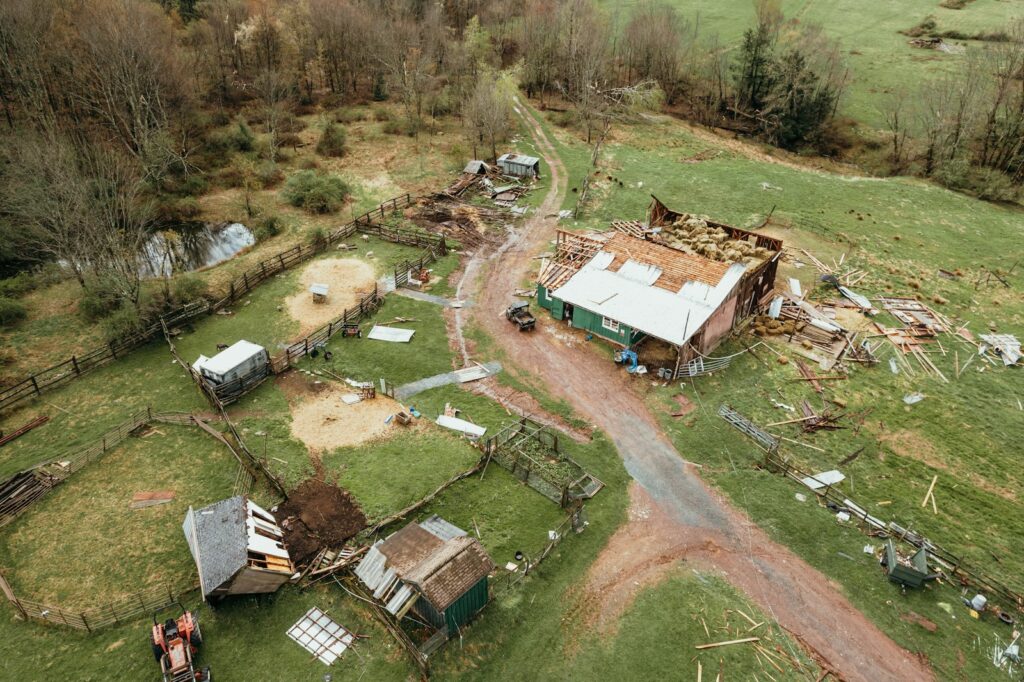 an aerial view of a farm with a dirt road