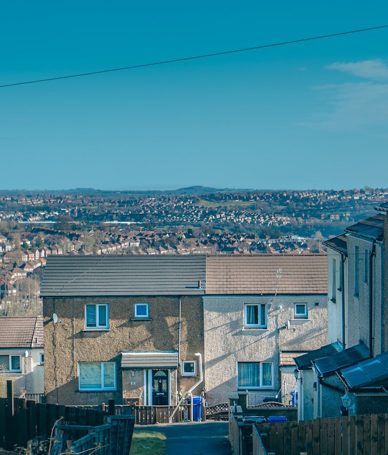 a view of a residential area with houses in the background