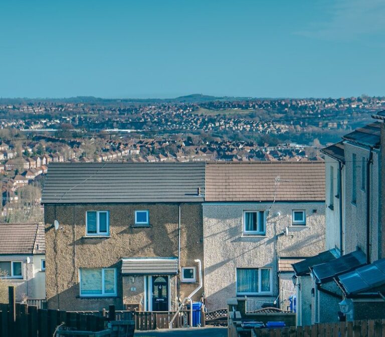 a view of a residential area with houses in the background