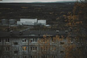 Industrial buildings and apartment block in autumn