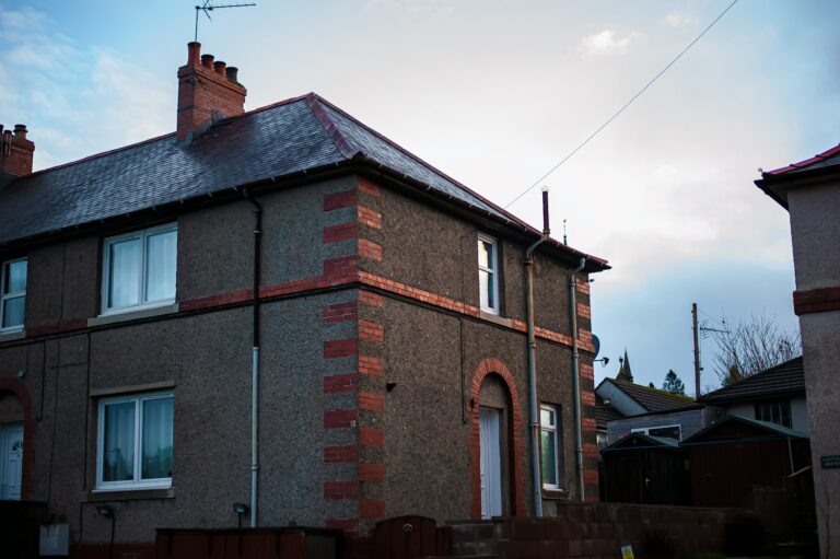 A large brick building with a sky background