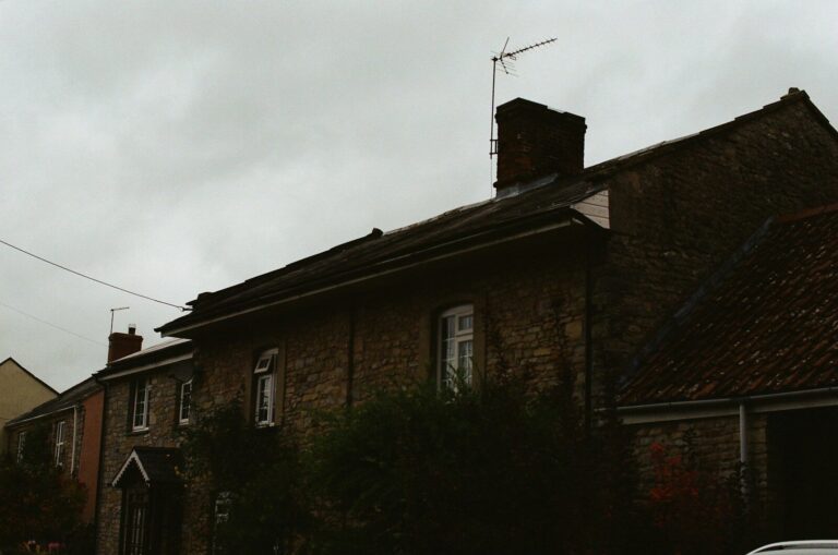 Old brick houses under a cloudy sky